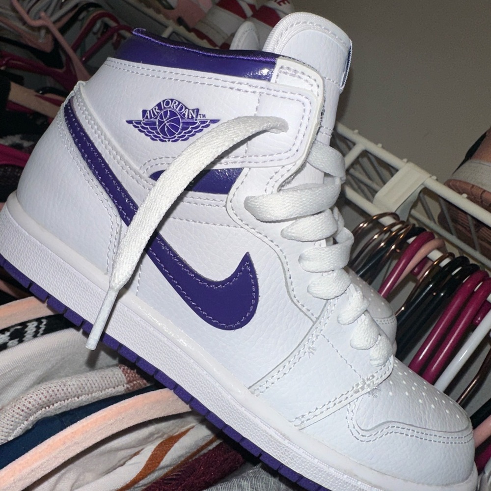 Purple and white Nike Jordan 1s